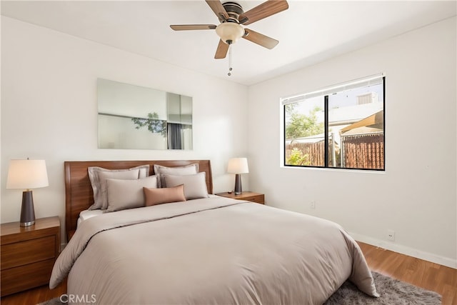 bedroom featuring ceiling fan and wood-type flooring