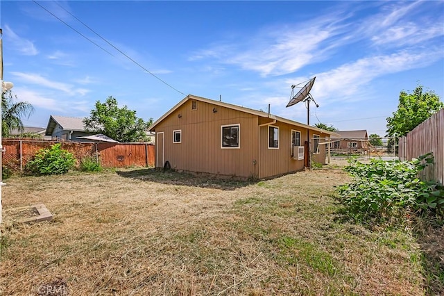 back of property featuring cooling unit