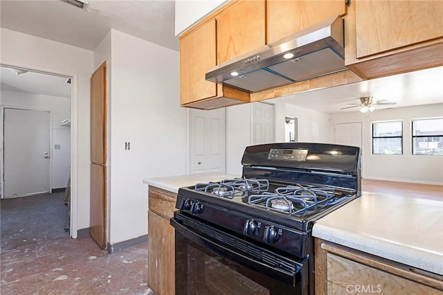 kitchen featuring black range with gas stovetop, ceiling fan, and range hood