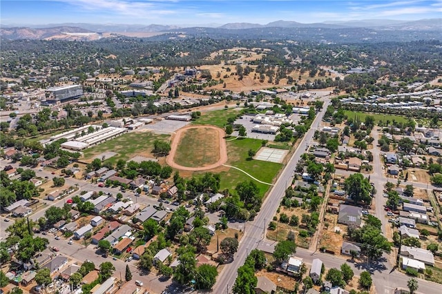 birds eye view of property with a mountain view