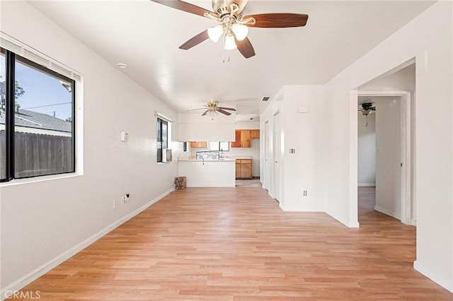 unfurnished living room featuring light hardwood / wood-style flooring