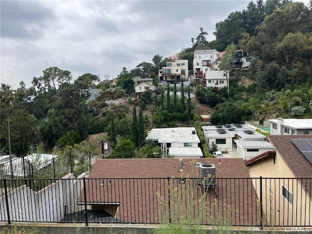 exterior space featuring fence and a residential view