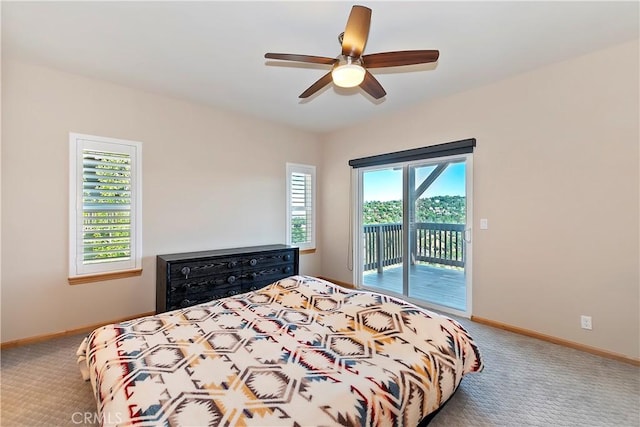 carpeted bedroom with access to outside, multiple windows, and ceiling fan