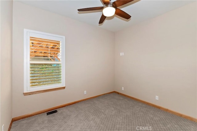 carpeted empty room with ceiling fan