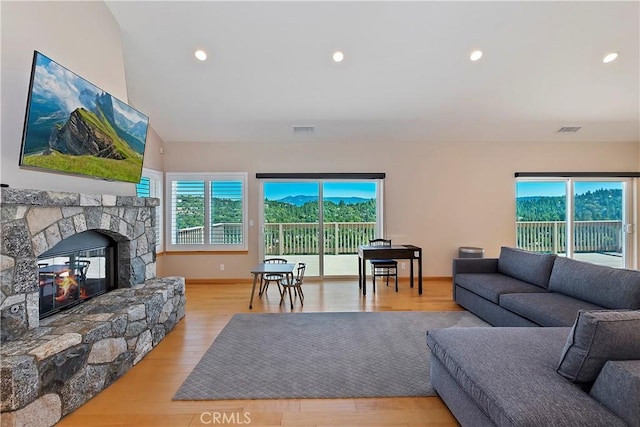 living room with a fireplace and light hardwood / wood-style floors