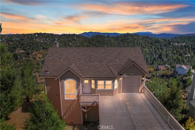 view of front of house with a mountain view and a garage