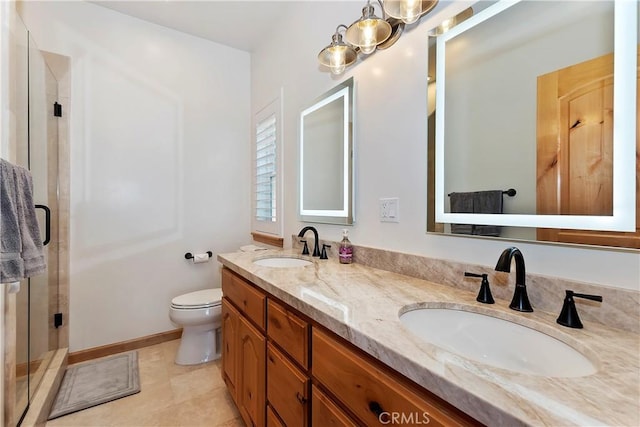 bathroom with tile patterned flooring, vanity, toilet, and an enclosed shower