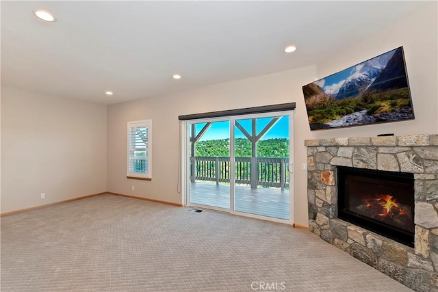 carpeted living room with a fireplace