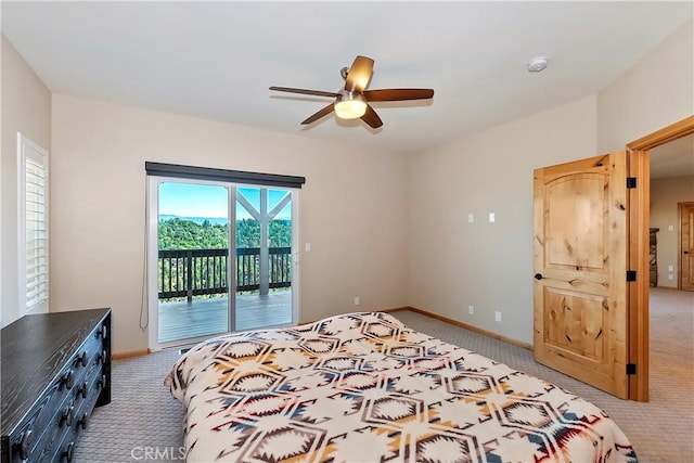 carpeted bedroom featuring access to exterior and ceiling fan