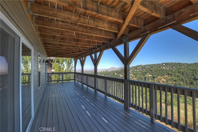 wooden deck featuring a mountain view