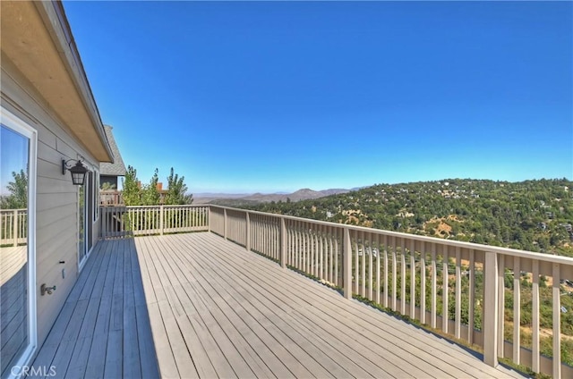 wooden deck featuring a mountain view