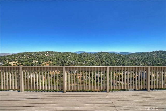 wooden terrace with a mountain view