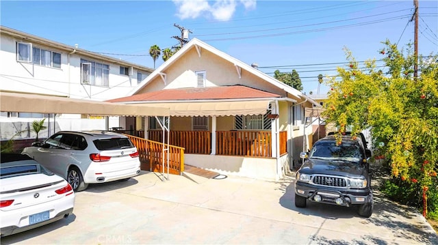 view of front facade with a carport