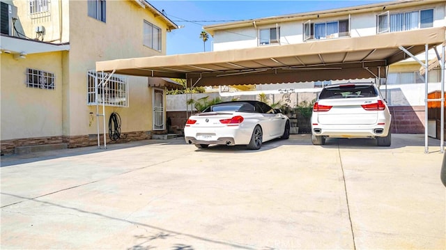 view of vehicle parking with a carport