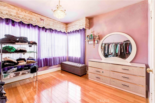 sitting room with a chandelier and hardwood / wood-style floors