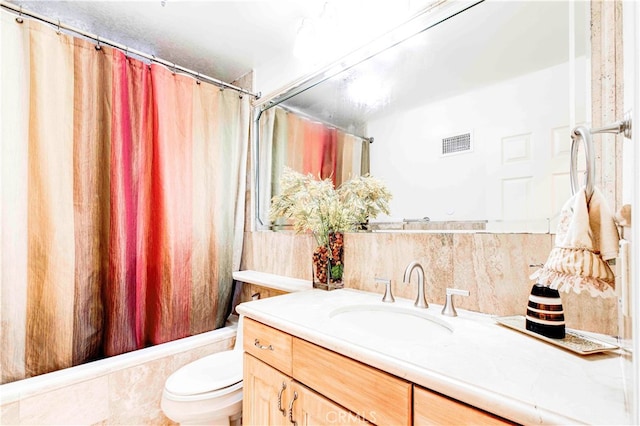 full bathroom with vanity, toilet, and shower / bathtub combination with curtain