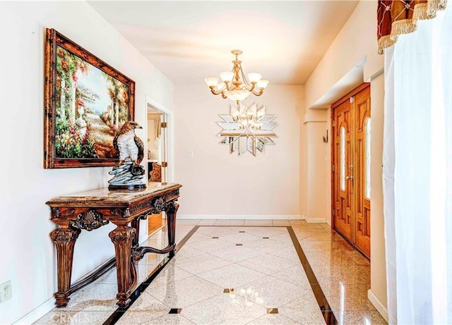 foyer with a notable chandelier