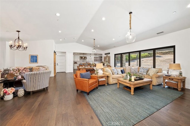 living room featuring a chandelier, dark wood-type flooring, and vaulted ceiling