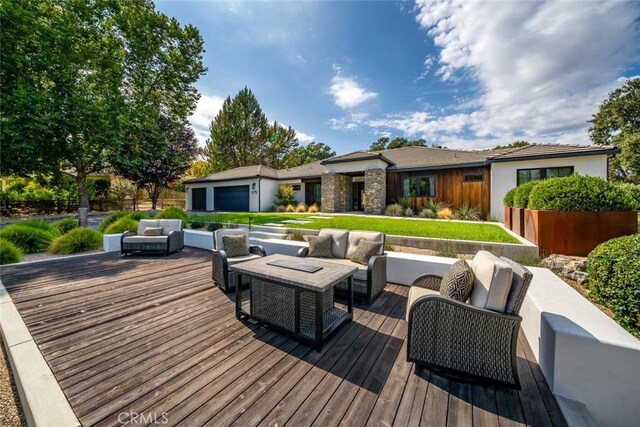 wooden terrace with an outdoor hangout area