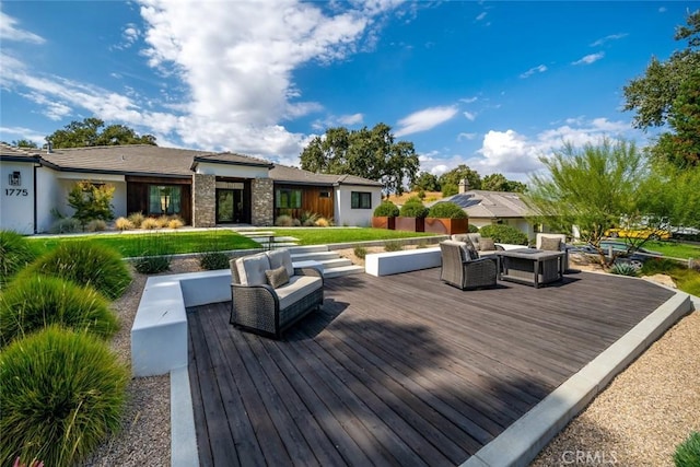 wooden terrace with outdoor lounge area