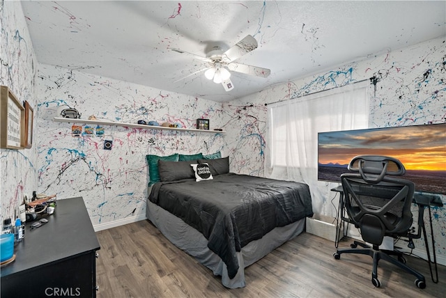 bedroom featuring wood-type flooring and ceiling fan