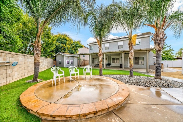 exterior space with a patio and a lawn