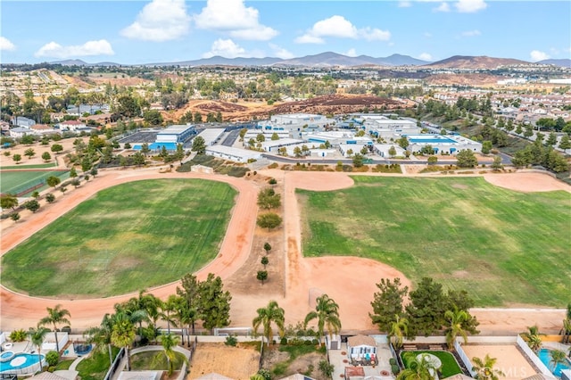 birds eye view of property featuring a mountain view