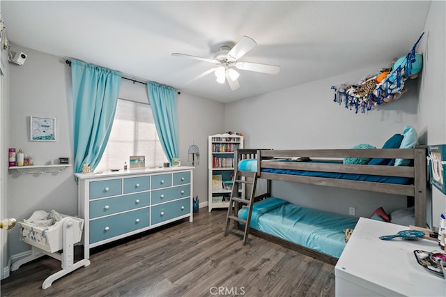 bedroom featuring ceiling fan and dark hardwood / wood-style floors