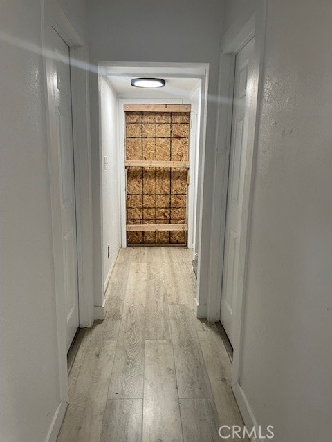 hallway featuring light hardwood / wood-style flooring