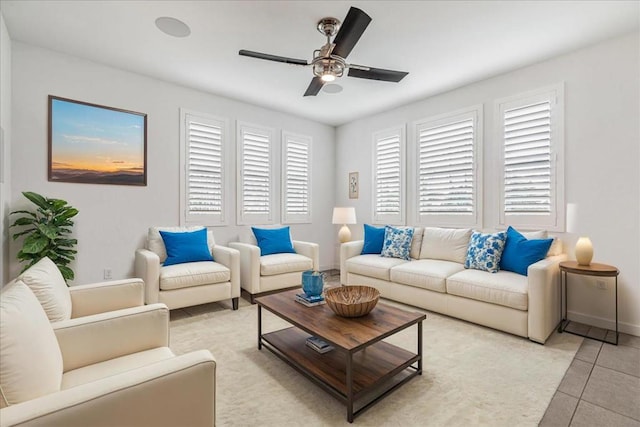 tiled living room with ceiling fan