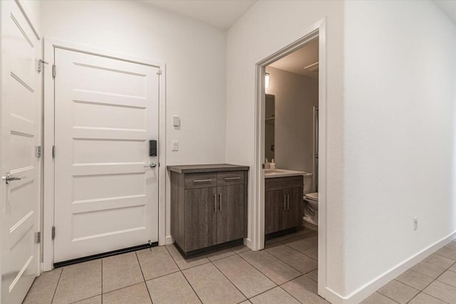 interior space with light tile patterned floors