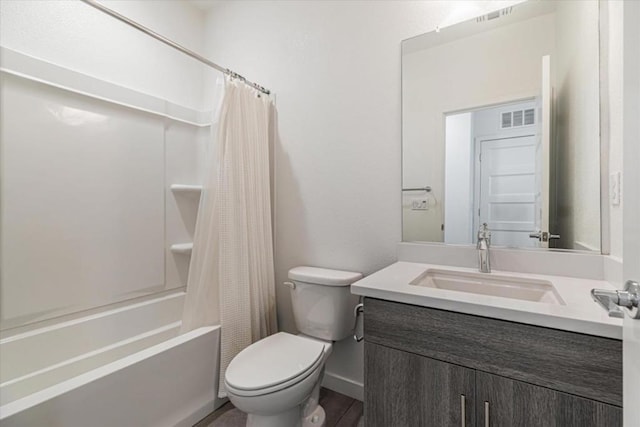 full bathroom with shower / bath combination with curtain, vanity, and toilet