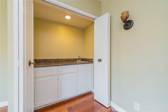 bathroom featuring vanity and hardwood / wood-style flooring