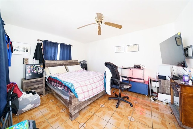 tiled bedroom with ceiling fan