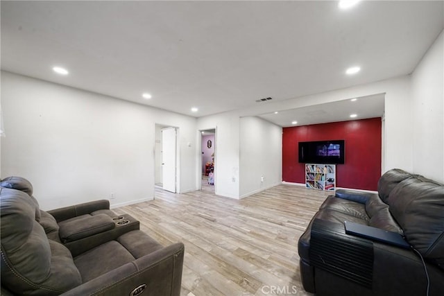 living room with light hardwood / wood-style flooring