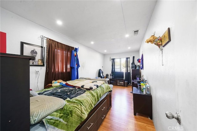 bedroom with light hardwood / wood-style flooring