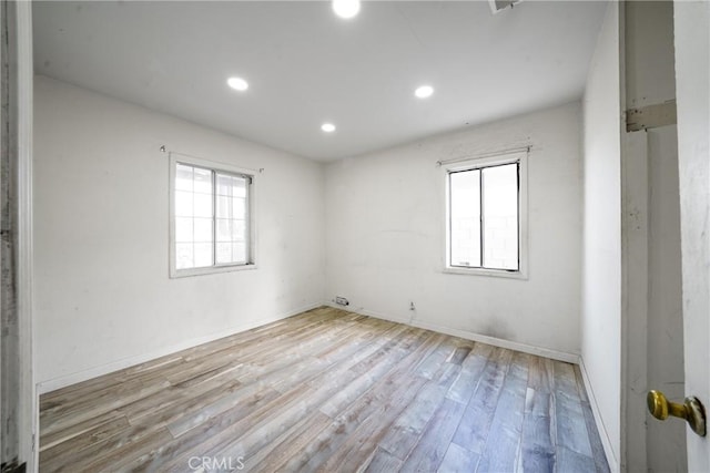 spare room featuring light wood-type flooring