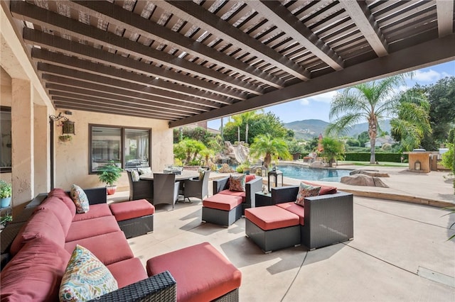 view of patio / terrace with an outdoor hangout area and a mountain view