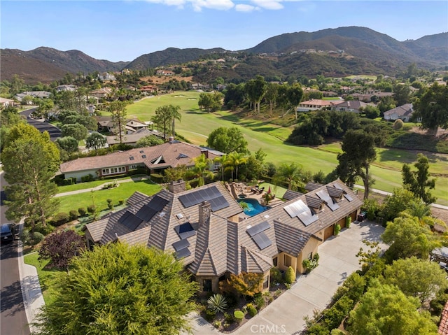 birds eye view of property featuring a mountain view