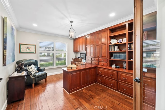 home office with ornamental molding and dark hardwood / wood-style floors