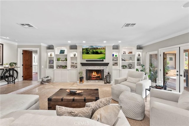 living room with french doors and ornamental molding