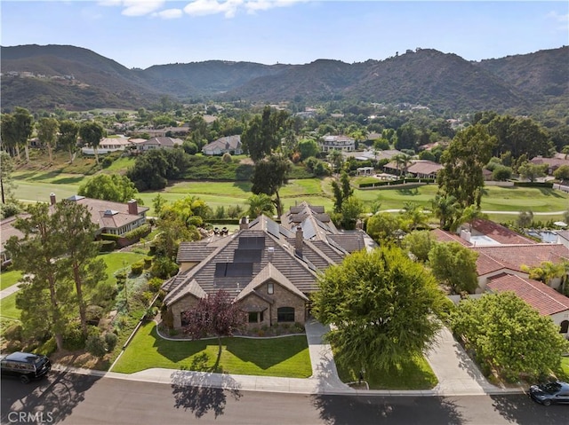 birds eye view of property featuring a mountain view