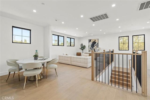 living room featuring a healthy amount of sunlight and light wood-type flooring