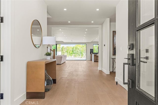 hall with light hardwood / wood-style flooring