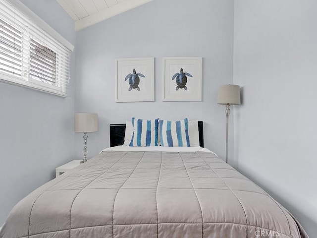 bedroom featuring vaulted ceiling