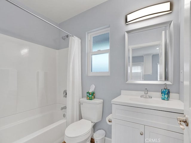 full bathroom with shower / bath combo with shower curtain, vanity, and toilet