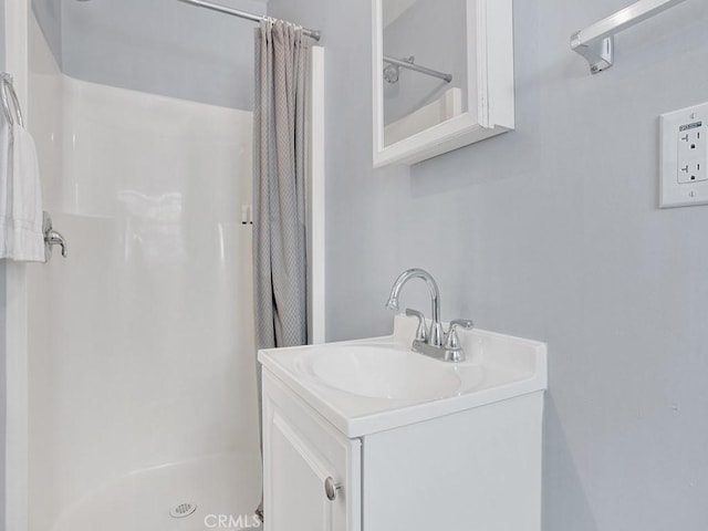 bathroom with vanity and curtained shower