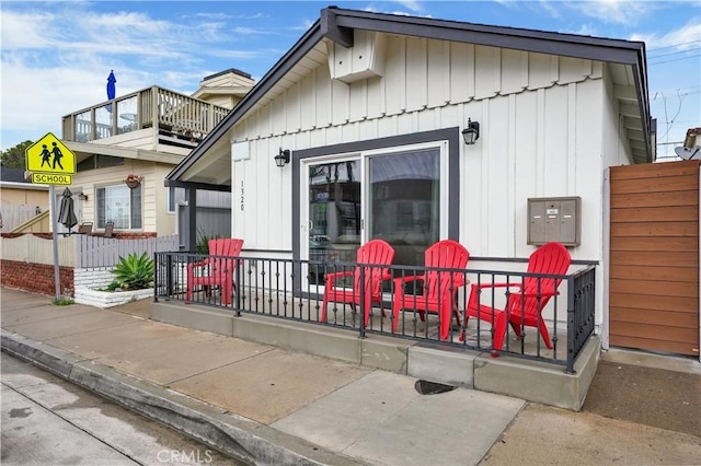 rear view of property with a balcony