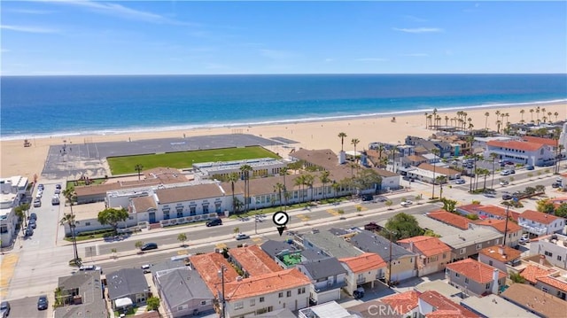 aerial view with a water view and a view of the beach