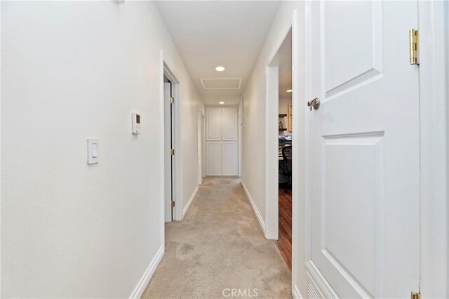 hallway with light carpet